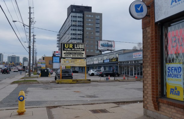 parking lot, strip mall, and newer condo building on Lawrence