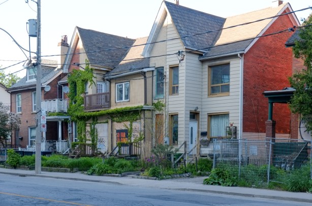 row of houses on the east side of Broadview near Eastern, two story, peaked roof, 