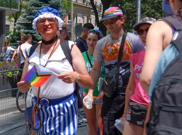 a person in blue and white striped bottoms and a matching frilly bonnet
