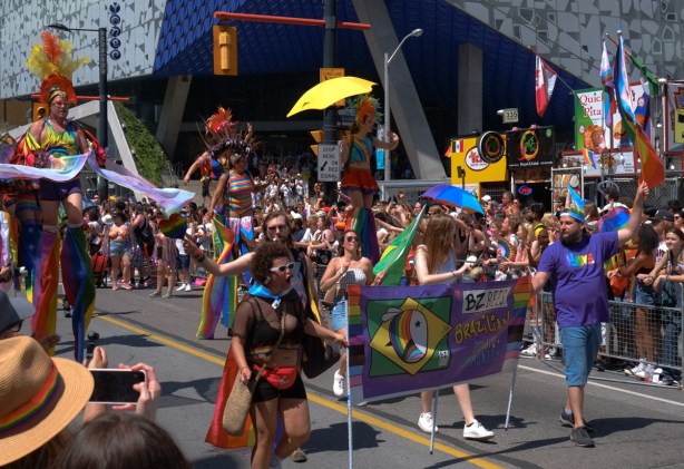 Brazilian Bees walking in pride parade