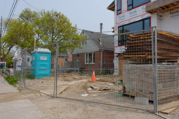 renovation and enlargement of a house, smaller older house beside