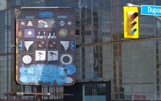 billboard with image by Maggie Groat, part of Scotiabank COntact photo festival, bottom part has been tagged