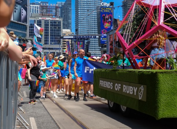 friends of Ruby float in pride parade passes by on Dundas Street