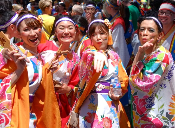 4 asian japanese women posing for the camera before the pride parade, 