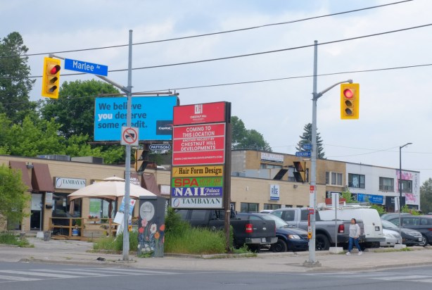 intersection of Marlee and with a plaza of stores, 