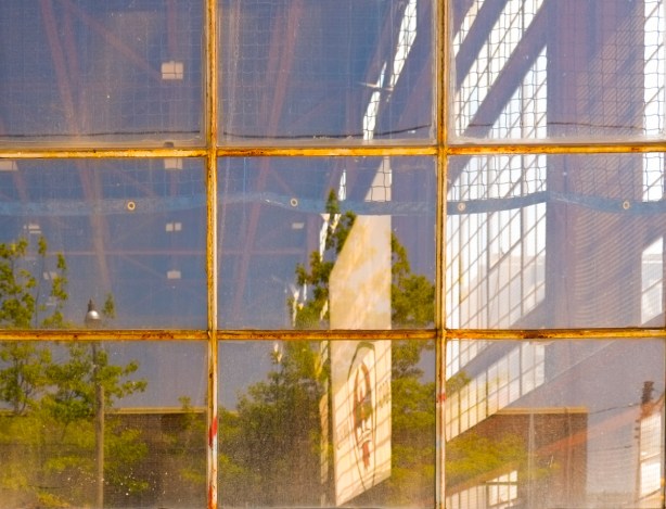looking into a large warehouse interior with lots of windows, nine window panes