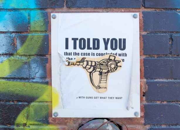 poster protesting condo development, picture of a gun, text that says I told you that those with the gun wins