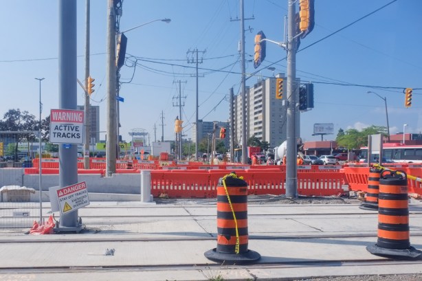 danger signs, active tracks, on new lrt rail tracks, at Jane and Finch