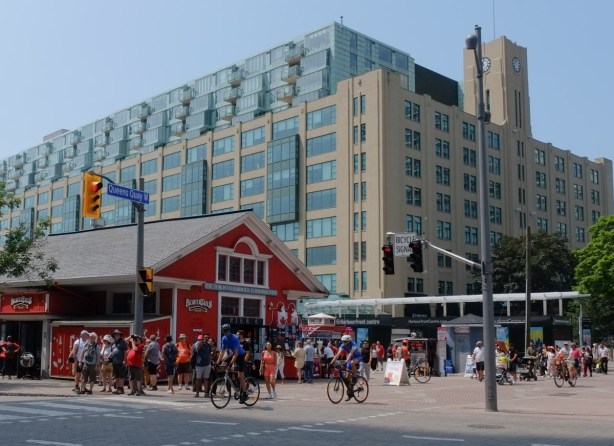queens quay at waterfront, red beaver tails store and gift shop, condos, people, 