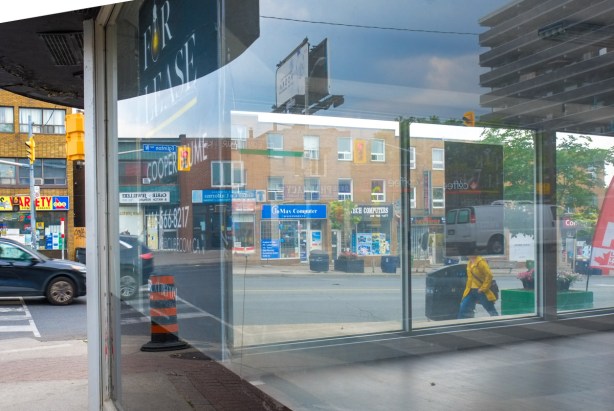 double window shot, some reflections in the window, some seeing through the glass., empty storefront at Eglinton and Marlee