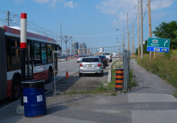 traffic and TTC bus on finch as approaching ramp to highway 400 north. 