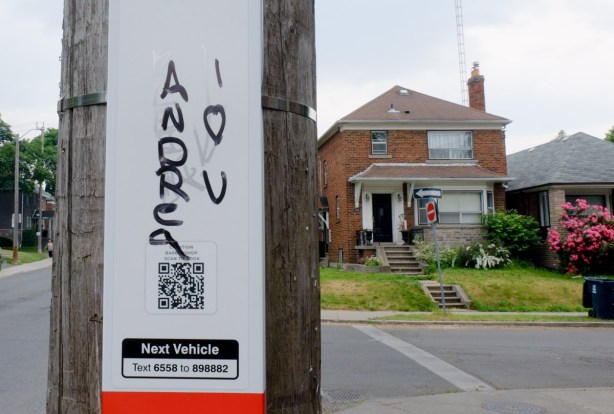 TTC bus stop pole, with graffiti, I love U Andrea