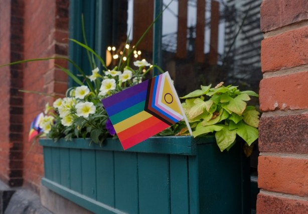 pride flag in a window box in the distillery