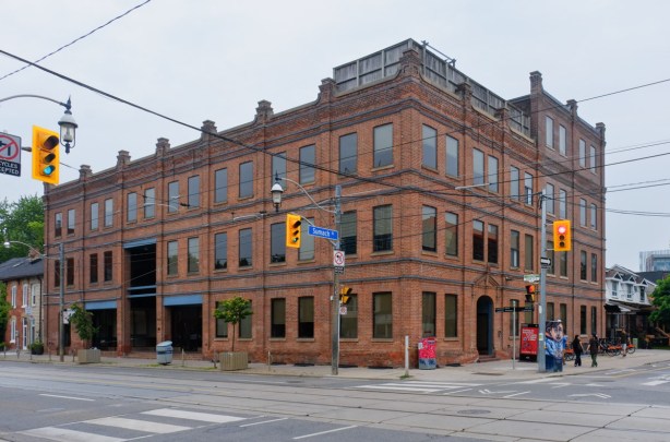 renovated post and beam brick building, three storeys high, once a warehouse and now office space