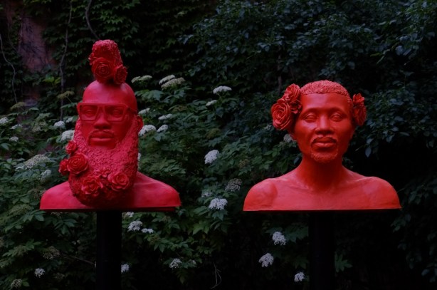 two of the red heads in Afrophilia, a sculpture installation in outdoor space
