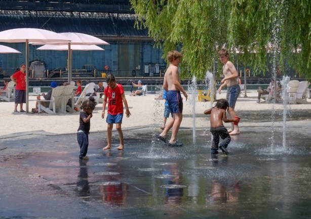 kids playing in a splash pad at sugar beach
