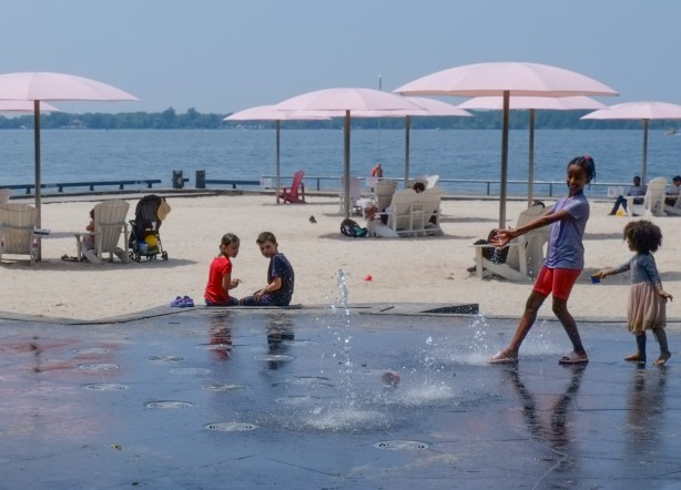 kids playing in a splash pad at sugar beach