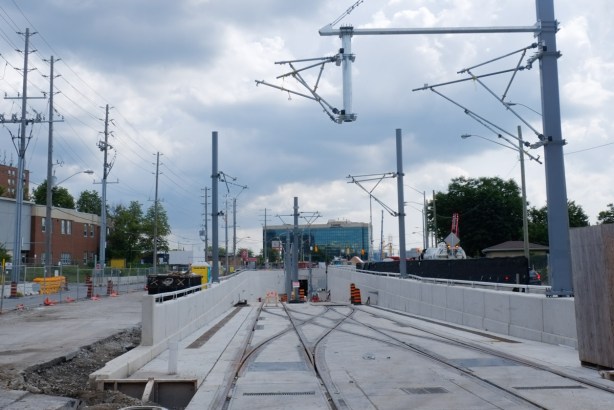 just west of Keele Street, on Finch, where tracks for new LRT go underground as they approach Finch west subway station, new construction, 