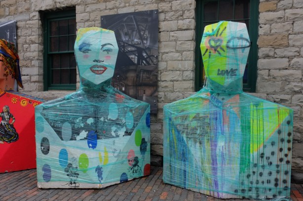 two painted human torso and head forms