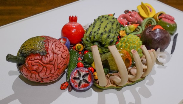 ceramic artwork by Thomas Haskell, fruits with human or animal anatomical characteristics