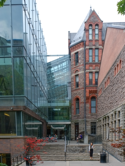 buildings, an old red brick one and a newer glass building