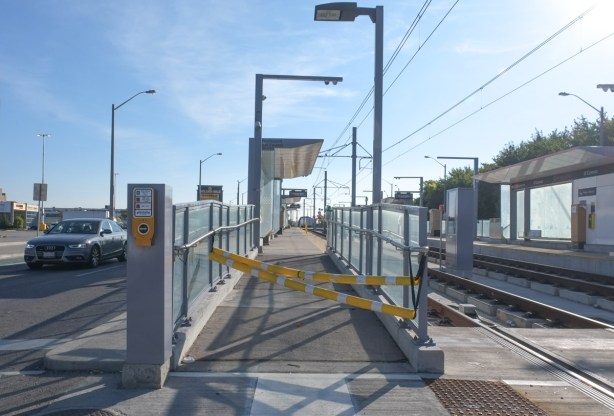 empty LRT station with yellow and white barricade