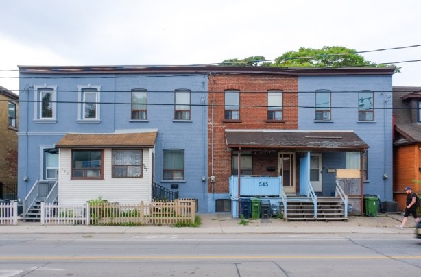 two storey old rowhouses on Queen St West