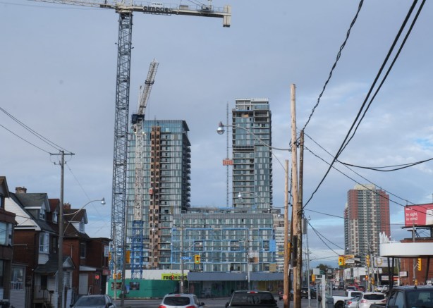 looking west on Dupont towards Dufferin, tall cranes and new condo highrise construction