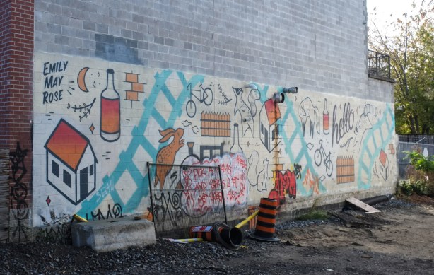 mural by Emily May Rose on wall by new pathway on east side of elevated rail line, just south of Wallace Ave 