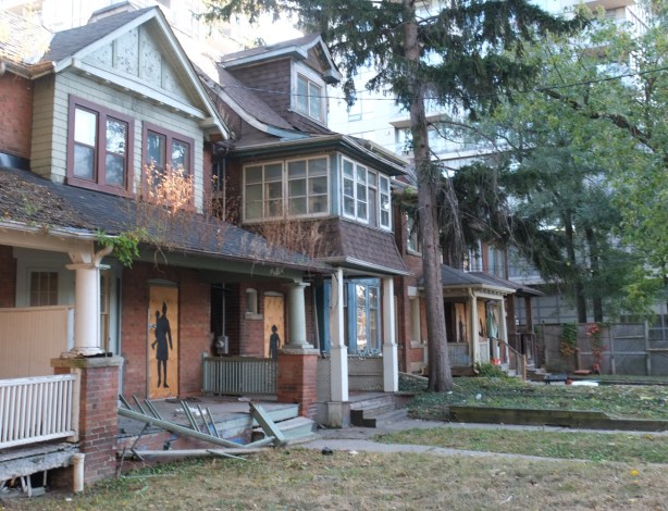row of houses boarded up and empty