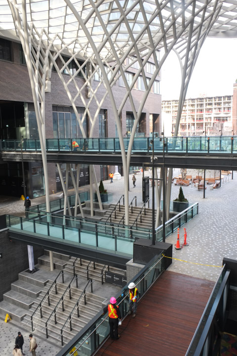 tall, vertical, but curved white roof supports at the well development in downtown toronto