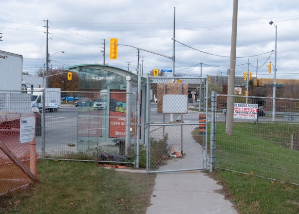 chainlink fence across sidewalk at Nugget Ave