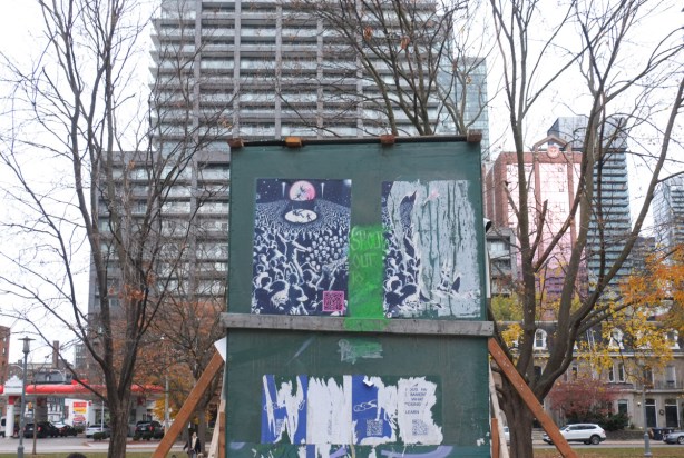 paper paste ups on plywood on boxed sculpture in clarence park 