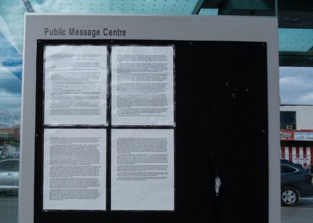 on public message board at a bus shelter, 4 pieces of 8 1/2 by 11 paper with typing on them, a collection of bible verses