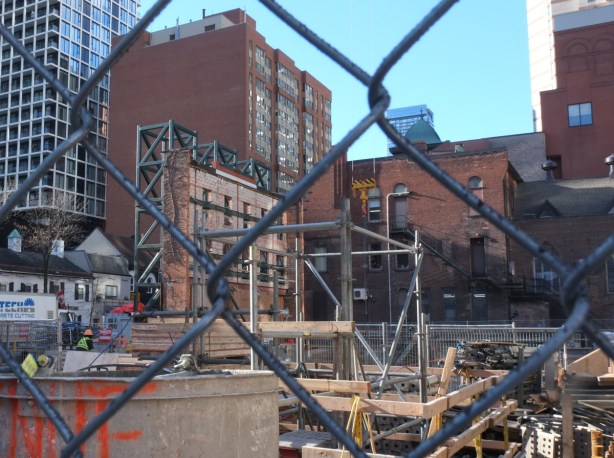 construction site behind chainlink fence