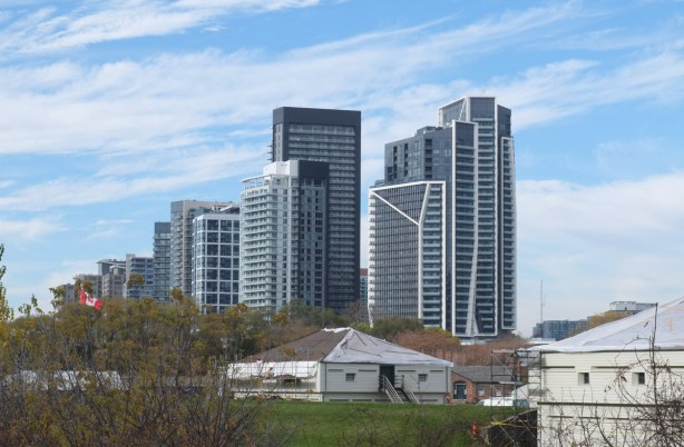buildings at fort york in the foreground, new condo high rise buildings in the background, looking northwest from Bathurst and Front 