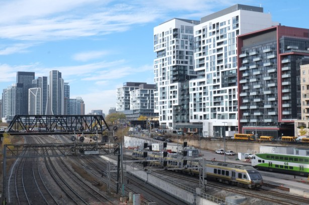 looking northeast across the railway corridor to Front Street and the new development along it at Bathurst St., Bathurst bridge over the tracks, and new condos in the distance 