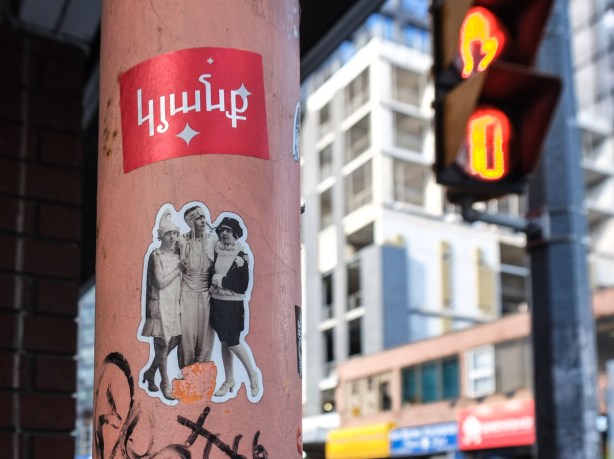 33wallflower33 slap graffiti on a pole, 3 ladies in period costume, black and white, 