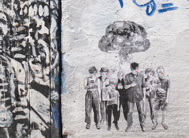 small paper graffiti stencil of a group of people in 3d glasses, all looking at their phones