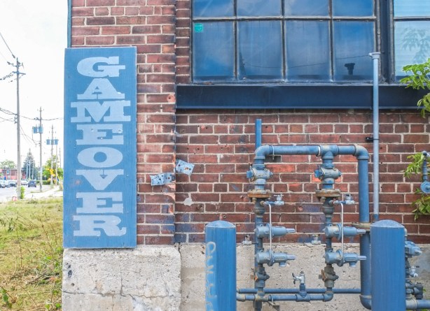 text on posters, graffiti, on empty buildings