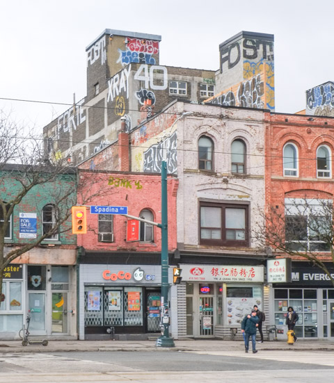 stores and buildings on the east side of Spadina, old brick buildings,