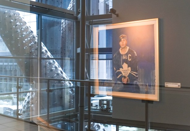 framed picture of Justin Bieber in a Maple LEafs jersey, blue, with a C, 