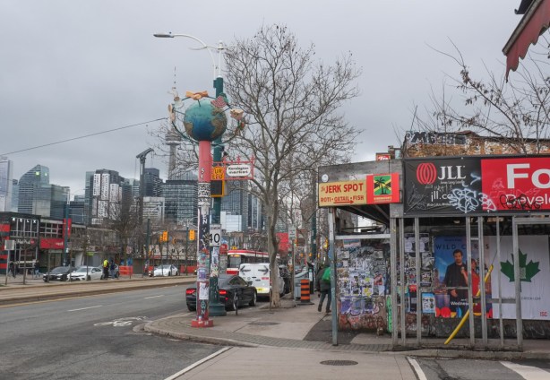 Spadina Ave, pole for entrance to Kensington, with globe on the top