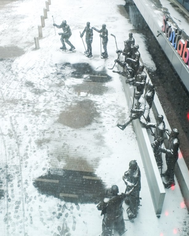 looking out window of scotiabank arena and seeing legends row, the line up of statues of former Maple Leafs captains