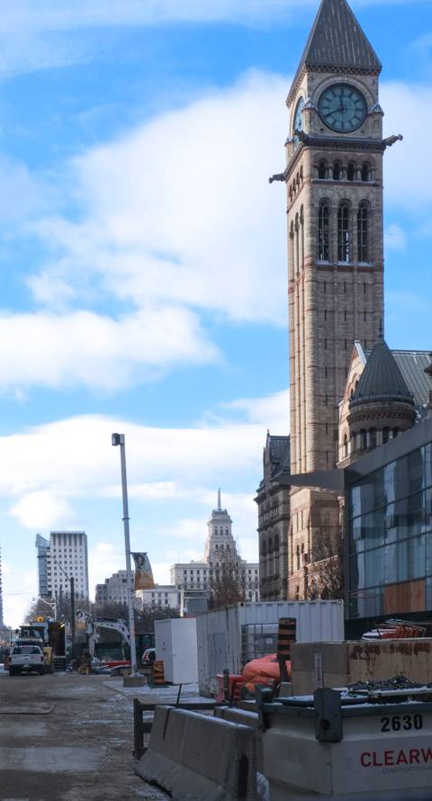 tower of old city hall with road construction in front of it