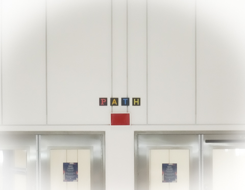 on a white wall, PATH sign, 