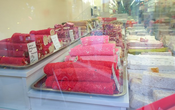 in a store window, rows of red rolls, turkish delight for sale, 