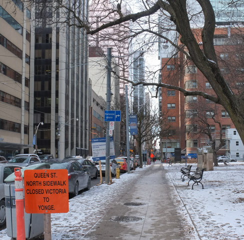 street scene, Queen St. East in front of Metropolitan United Church,looking west towards Victoria Street. 