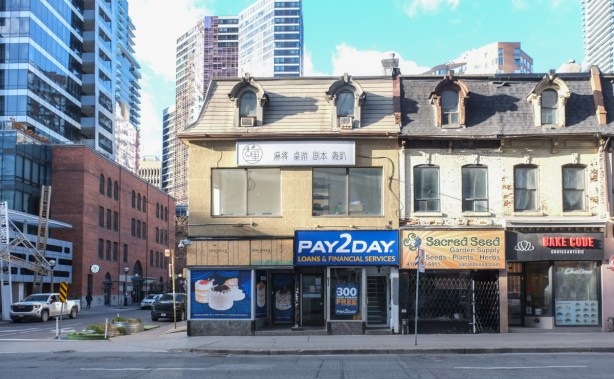 old buildings from the 1800s on Yonge street, two storey, store fronts, brick, at St. Joseph street , Pay2day, Sacred Seed, 