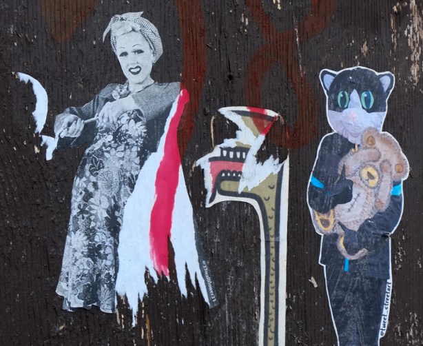 33wallflower 33 black and white paste up besie a catchoo worm sticker along with a tweety street art cat holding a teddy bear